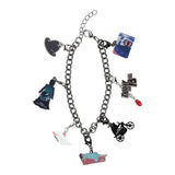 Bracelet with various horror-themed charms on a white background