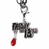 Keychain with 'Friday the 13th' charm and red gem on a white background