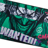 Close up of Batman Joker Desk Mat with a graphic design of a Jocker's face and WANTED! text on a white background