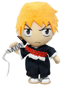 Plush toy of Bleach animated character Ichigo with orange hair and a sword on a white background