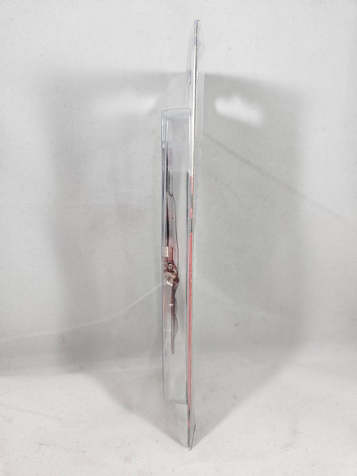 Clear plastic bag with a small object inside on a white background