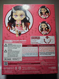 Back view of a figurine packaging with character illustration and warning labels.