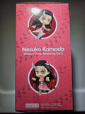Pink packaging of a figurine with 'Nezuko Kamado' on a gray background