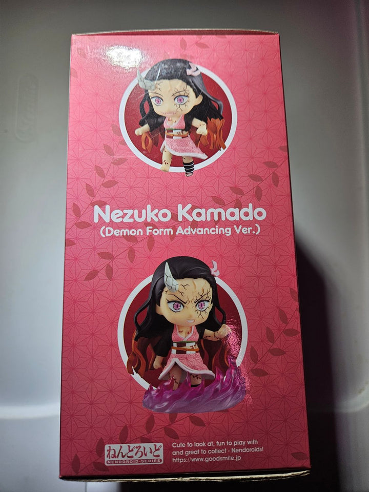 Pink packaging of a figurine with 'Nezuko Kamado' on a gray background