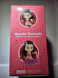 Pink packaging of a figurine with 'Nezuko Kamado' on a gray background