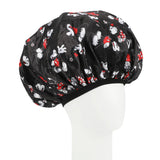 Black sleep cap with cartoon character pattern on a white mannequin head