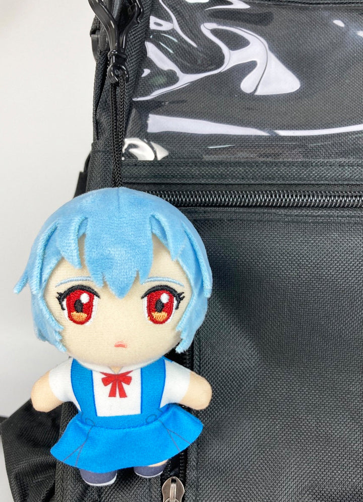 Plush Evangelion keychain with Rei Ayanami in blue school uniform attached to a black bag.