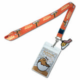 An orange Gudetama-themed lanyard with matching printed ID badge and a small enamel charm, shown on a plain white background.