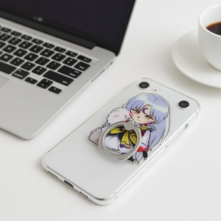 Phone case with anime character design on a desk with a laptop and coffee.