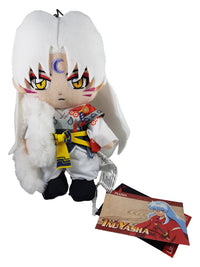 Plush toy of an anime character with a card featuring the same character on a white background