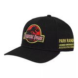 A black structured baseball cap featuring the Jurassic Park logo embroidered on the front and yellow text reading 'PARK RANGER LICENSED DINO SAURIE' on the side, shown against a plain white background.