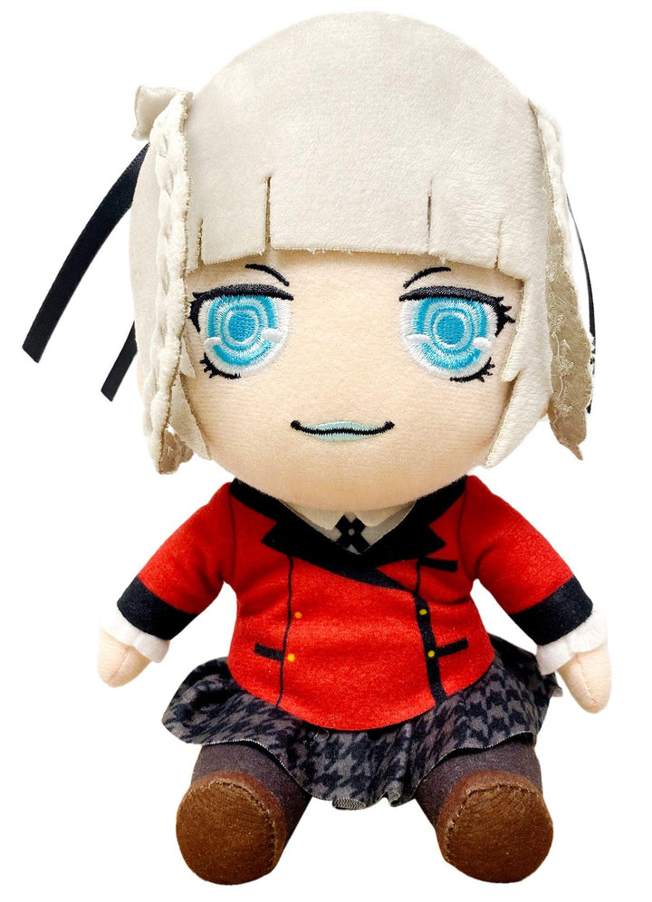 A plush doll with large blue eyes, short cream hair, and a red-and-black outfit, photographed on a plain white background.