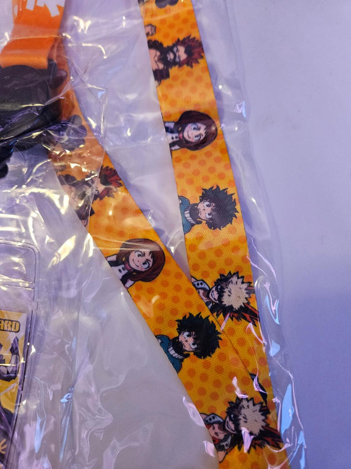 Yellow neck strap of lanyard with My Hero Academia character pattern in clear packaging on a white background