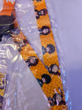 Yellow neck strap of lanyard with My Hero Academia character pattern in clear packaging on a white background