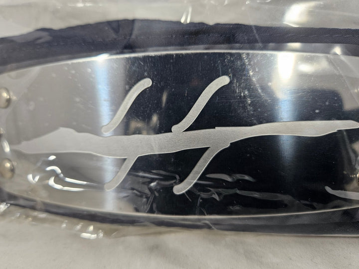 Close up of Naruto Anti Mist Village Black headband with metal plate engraved with Anti Mist Village symbol and packaged in plastic on a white background