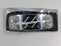 Naruto Anti Mist Village Black headband with metal plate engraved with Anti Mist Village symbol and packaged in plastic on a white background