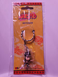 Naruto keychain packaging with character figure on a yellow background