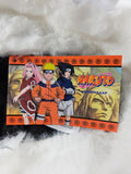 Naruto-themed product packaging with characters on a white fluffy background