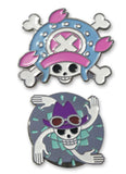 Two One Piece enamel pins featuring skull designs of Chopper and Nico Robin with colorful accents on a white background.