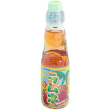 Bottle of Ramune mango drink with colorful label on a white background