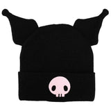 Black beanie with Kuromi pink skull design on a white background