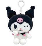 A plush toy character with a black and white face and cat-like ears, featuring a pink skull emblem and a white hanging loop.