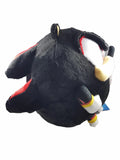 A plush toy of Sonic's shadow side, featuring black fur with red accents, white inner ears, and yellow gloves, shown against a plain white background.