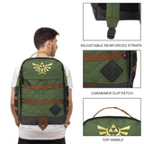 Legend of Zelda Hyrule backpack with gold emblem worn by a person, showing details like adjustable straps and carabiner clip patch