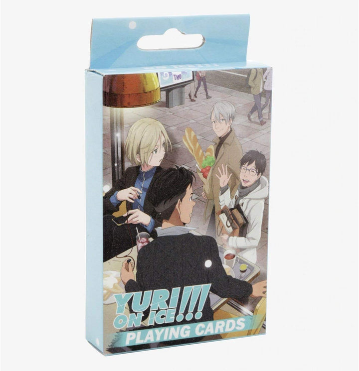Playing card set packaging featuring characters from 'Yuri!!! on Ice' with a light blue background.