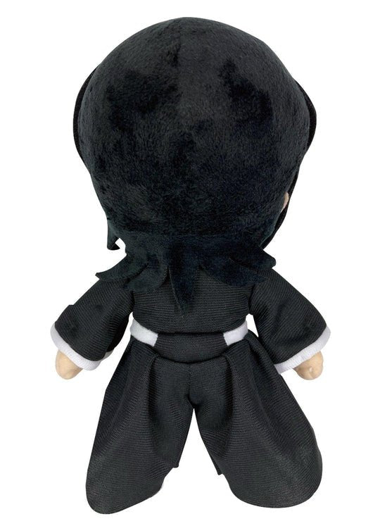 A plush toy doll shown from the back, featuring black hair, a black outfit, and a white belt, set against a plain white background.