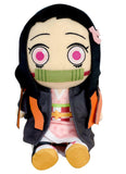 Demon Slayer Nezuko Kamado 8-inch sitting pose plush doll front view showing black hair pink flower accessory embroidered pink eyes green bamboo muzzle pink floral kimono black haori with orange flame lining panels and white tabi socks officially licensed by Great Eastern Entertainment