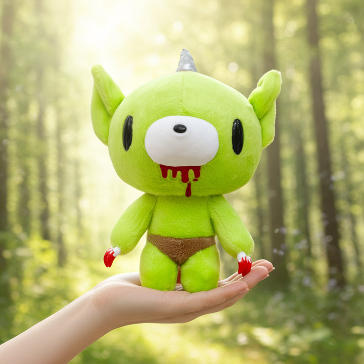 Green Gloomy Bear Goblin plush toy with a forest background