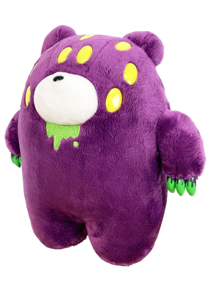 A plush bear toy shaped like a cute purple monster with yellow spots, a white nose, green dripping drool, and green claws, conveying a playful vibe.