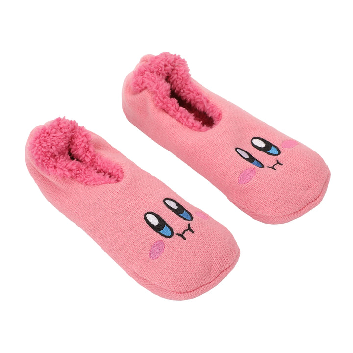 Pink slippers with a cute, cartoon face design, including large eyes and blushing cheeks. The interior is lined with soft, fluffy material.