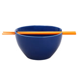 Naruto Uzumaki ceramic ramen bowl side view showing navy blue exterior glaze and orange chopsticks resting in built-in chopstick holder slot on rim by Bioworld