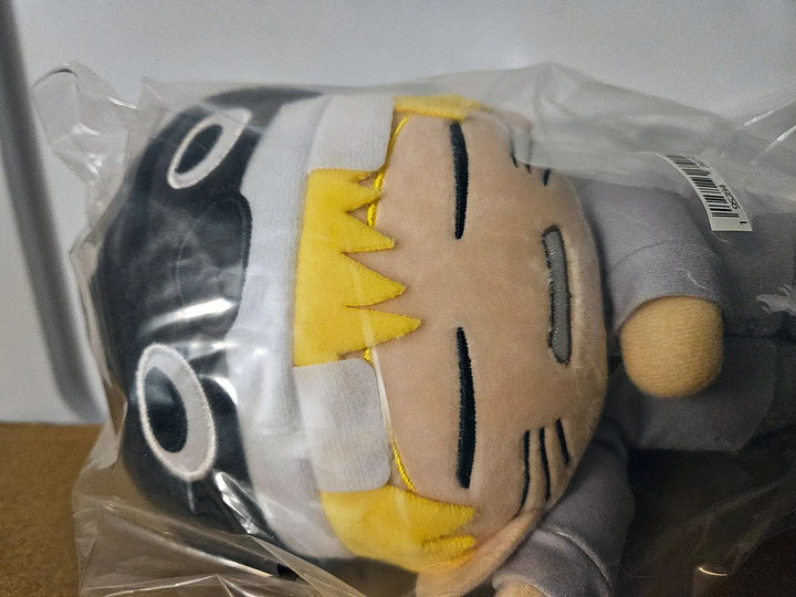 Naruto Uzumaki plush with embroidered closed eyes and whisker marks, packaged close-up, by Great Eastern Entertainment.