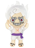 One Piece Luffy Gear 5 Awakening 9 inch Plush Doll front view showing white voluminous Sun God Nika hair embroidered spiral eyebrows crimson eyes grinning smile white open-chest top with gold Nika mark purple sash belt white shorts and tan sandals officially licensed by Great Eastern Entertainment