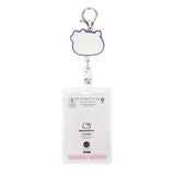 Back of retractable badge holder with a cartoon cat design and clear plastic case.