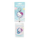 Hello Kitty retractable lanyard and badge holder on a blue cloudy background.