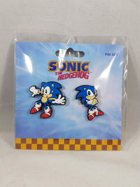 Sonic the Hedgehog Classic Sonic Sneak and Pose lapel pin set of 2 in official packaging showing sneaking pose pin and arms-crossed attitude pose pin on blue sky checkerboard card by Great Eastern Entertainment licensed by SEGA
