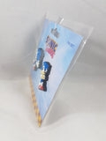 Side angle view of Sonic the Hedgehog Classic Sonic Sneak and Pose lapel pin set of 2 in official sealed packaging showing pin card thickness and hang tab by Great Eastern Entertainment licensed by SEGA