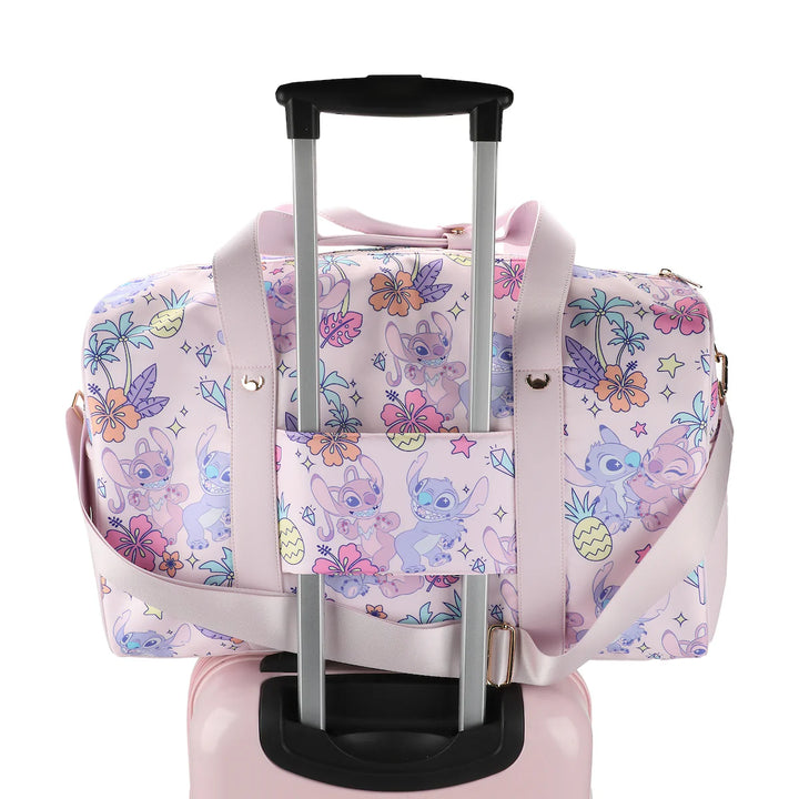 Disney Stitch duffel bag attached to rolling luggage handle showing trolley sleeve feature for travel