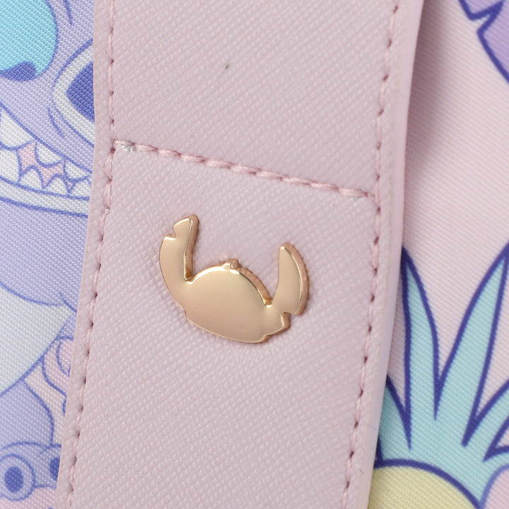 Close-up of Stitch metal hardware detail on pink duffel bag