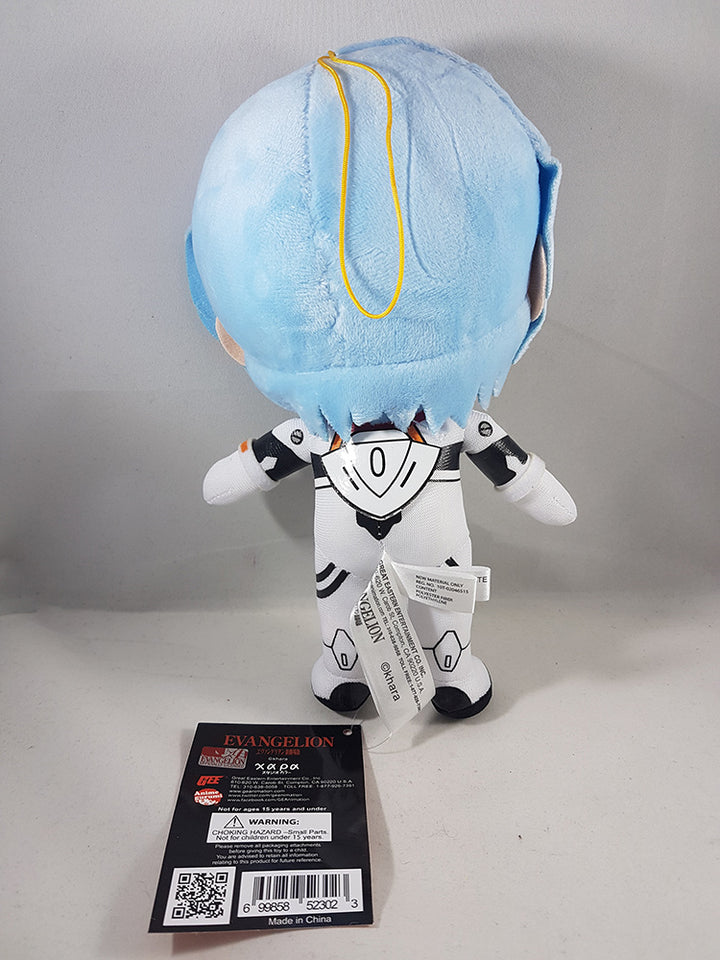 Back view of Evangelion Rei Ayanami Plugsuit 9-inch plush doll out of bag showing light blue plush hair yellow hanging cord loop sewn-in care label and orange Evangelion hang tag with Great Eastern Entertainment branding and barcode