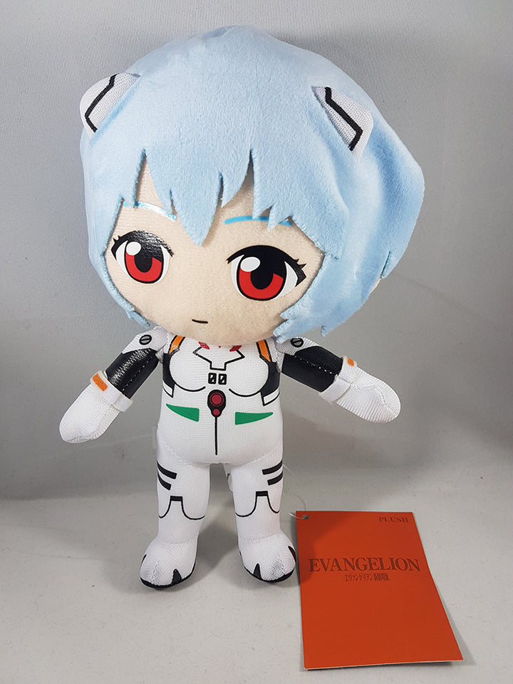 Evangelion Rei Ayanami Plugsuit 9-inch plush doll front view out of bag showing SD chibi standing pose light blue soft plush hair large red eyes white plugsuit black arm panels red chest gem green hip triangles and orange Evangelion hang tag by Great Eastern Entertainment