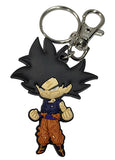 Dragon Ball Super Goku Ultra Instinct SD chibi die-cut soft PVC keychain showing dark grey hair navy gi orange pants clenched fists with silver metal split ring and lobster claw clasp on white background officially licensed by Great Eastern Entertainment